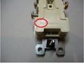 Image 3. Rear view of recalled receptacle with location of date code circled